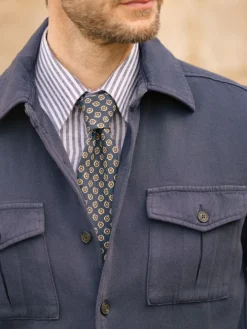 Cravate bleue en soie à motifs disques