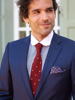 Cravate tricot en soie rouge grenat à pois blancs